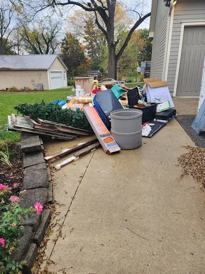 Dumpster being loaded with debris for Residential Dumpster Rental in Oil City